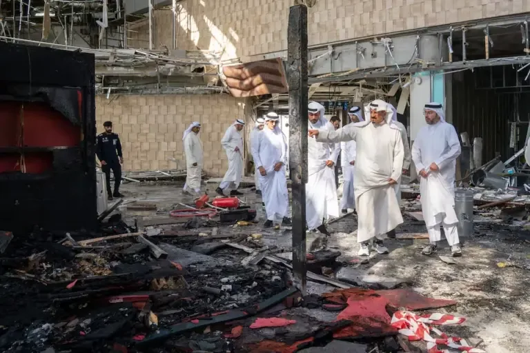 Kuwaiti Prime Minister Sheikh Ahmad al-Abdullah al-Sabah (2nd from right) inspecting the damaged airport after an Iranian attack. (AFP).