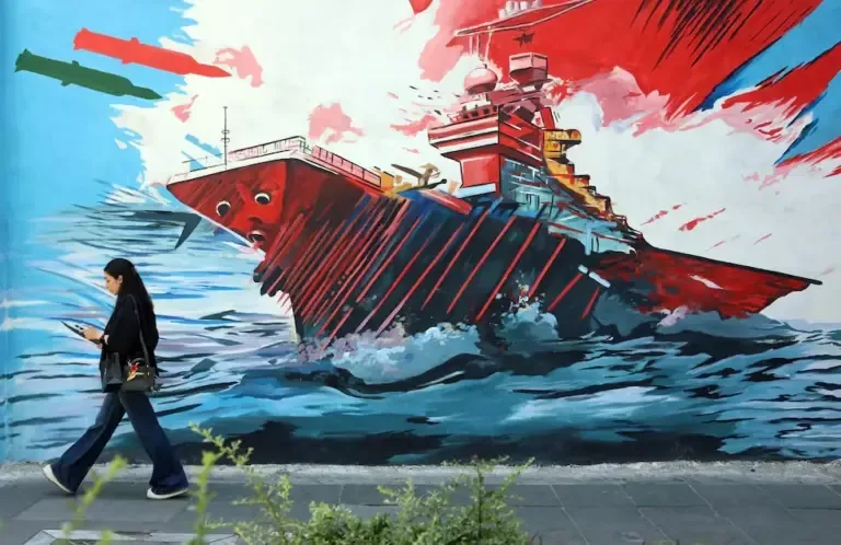 An Iranian woman walks past an anti-American and Israeli mural in Tehran, June 3, 2026. (EFE/EPA/ABEDIN TAHERKENAREH).