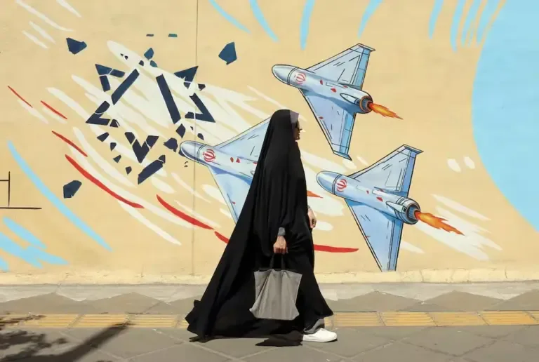 A woman walks past an anti-Israel mural in Tehran, Iran. (EFE/ Abedin Taherkenareh).