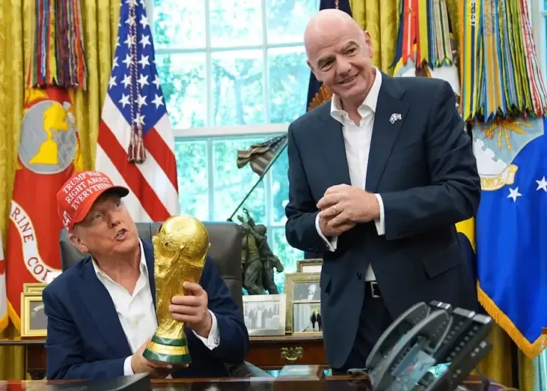 FILE - President Donald Trump holds the FIFA World Cup trophy with FIFA President Gianni Infantino, August 22, 2025, at the White House (AP Photo/Jacquelyn Martin, File)