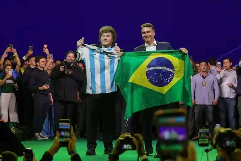 Argentine president Javier Milei holds an Argentina national team jersey alongside Senator Flavio Bolsonaro, who holds a Brazilian flag, in São Paulo, Brazil, on July 25, 2026. (Photo by Allison Sales/NurPhoto).