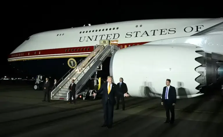 U.S. President Donald Trump gestures in front of Air Force One after disembarking from the old VC-25A Air Force One at the Royal Air Force (RAF) base in Mildenhall, eastern England, on July 8, 2026. (Photo by SAUL LOEB / AFP).