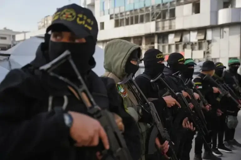 Palestinian militants armed with Hamas and Islamic Jihad gather for Eid al-Fitr prayers in Gaza City, March 20, 2026. (AP Photo/Abdel Kareem Hana, file).