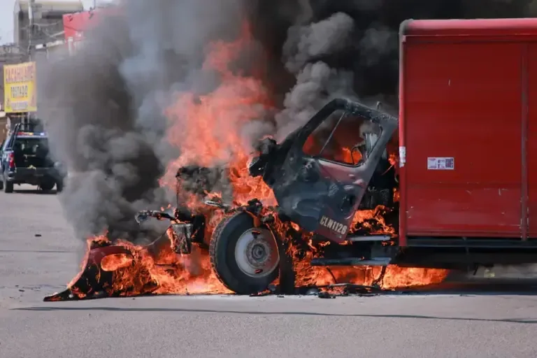 A burning truck on the streets of Culiacán, Sinaloa state, Mexico, on September 11, 2024, in the midst of the war between Los Chapitos and the faction of Ismael El Mayo Zambada. (Photo by Iván MEDINA / AFP).
