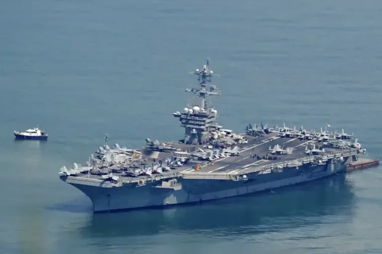 The USS George Washington aircraft carrier arrives at the port of Danang, Vietnam, on July 30, 2026. (Photo by Nhac NGUYEN / AFP).