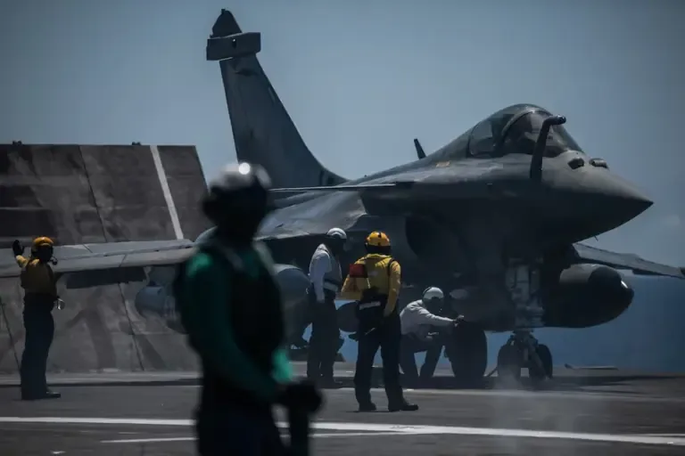 A Rafale fighter jet prepares to take off from the deck of the French aircraft carrier Charles de Gaulle during the NATO military exercise Neptune Strike 26-2 (Photo by Angelos TZORTZINIS / AFP).
