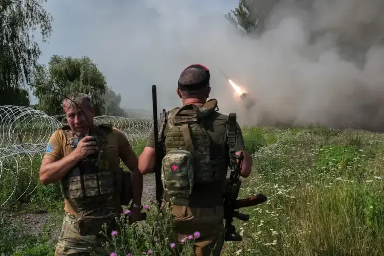 This photograph, distributed on August 4, 2026, shows Ukrainian soldiers firing at Russian positions with an MRLS BM-21 multiple rocket launcher system