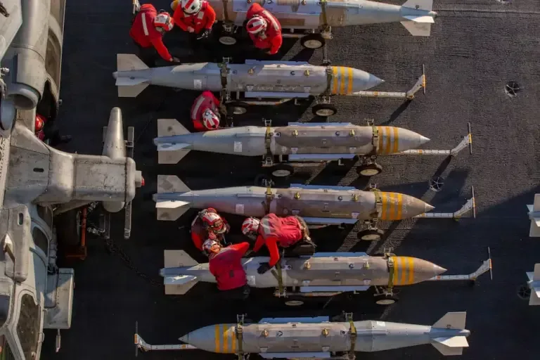 U.S. sailors on the flight deck of the Nimitz-class aircraft carrier USS Abraham Lincoln supporting Operation Epic Fury against Iran, at an undisclosed location on February 28, 2026. (AFP).