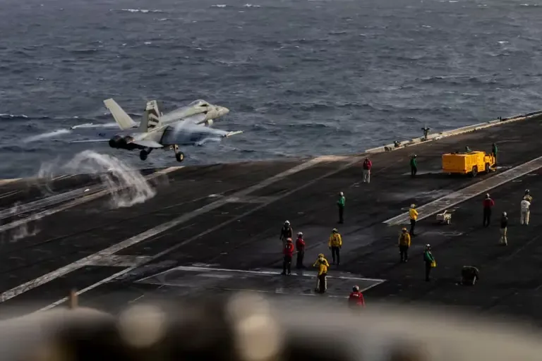 This photo from the U.S. Navy, published on August 4, 2026, shows an F/A-18E Super Hornet taking off from the flight deck of the Nimitz-class aircraft carrier USS Abraham Lincoln on July 31, 2026. (AFP).