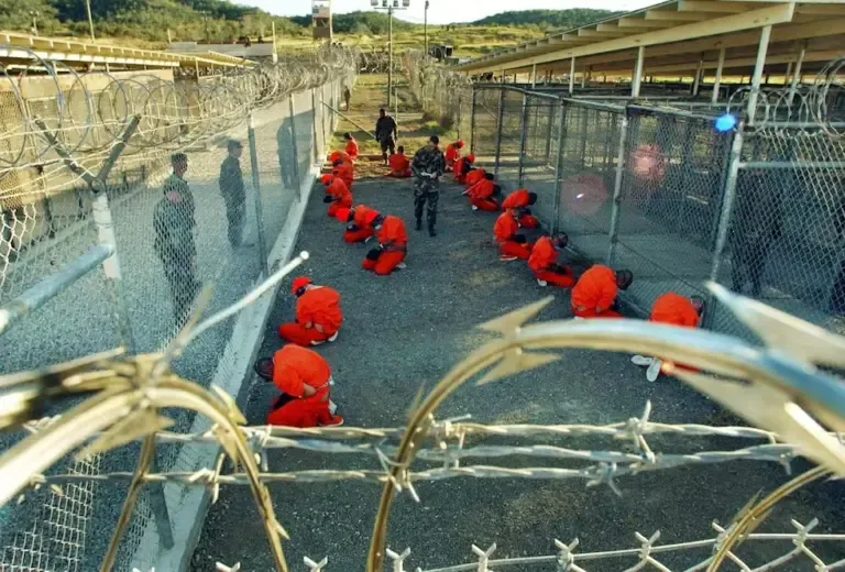 In this photo published on January 18, 2002, by the Department of Defense, members of Al Qaeda and the Taliban detained at Camp X-Ray at the Guantánamo Bay Naval Base, Cuba. (AFP PHOTO / US NAVY / Shane T.McCOY).