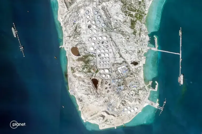 This satellite image taken by 2026 Planet Labs PBC shows a view of Iran's Kharg Island, which houses the country's main oil export terminal and is responsible for the vast majority of its crude shipments to the world. (Photo by 2026 Planet Labs PBC / AFP).