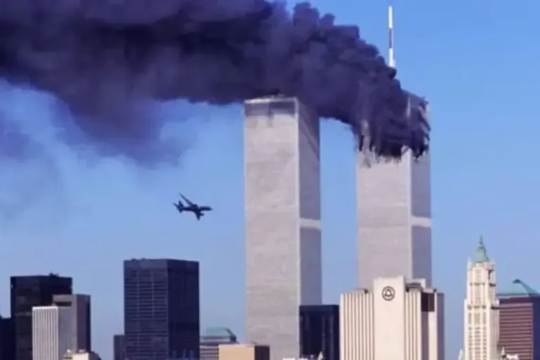 In this archival photo taken on September 11, 2001, a hijacked commercial airplane approaches the Twin Towers of the World Trade Center shortly before crashing into the iconic New York skyscraper. (Photo: SETH MCALLISTER / AFP)