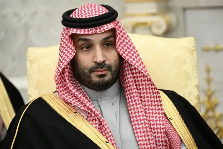The Crown Prince and Prime Minister of the Kingdom of Saudi Arabia, Mohammed bin Salman, observes during a meeting with U.S. President Donald Trump at the White House, November 18, 2025. (Photo by Brendan SMIALOWSKI / AFP).