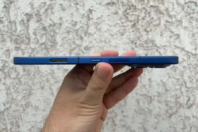 Side view of the phone, showing the power and volume buttons, as well as the health sensor.